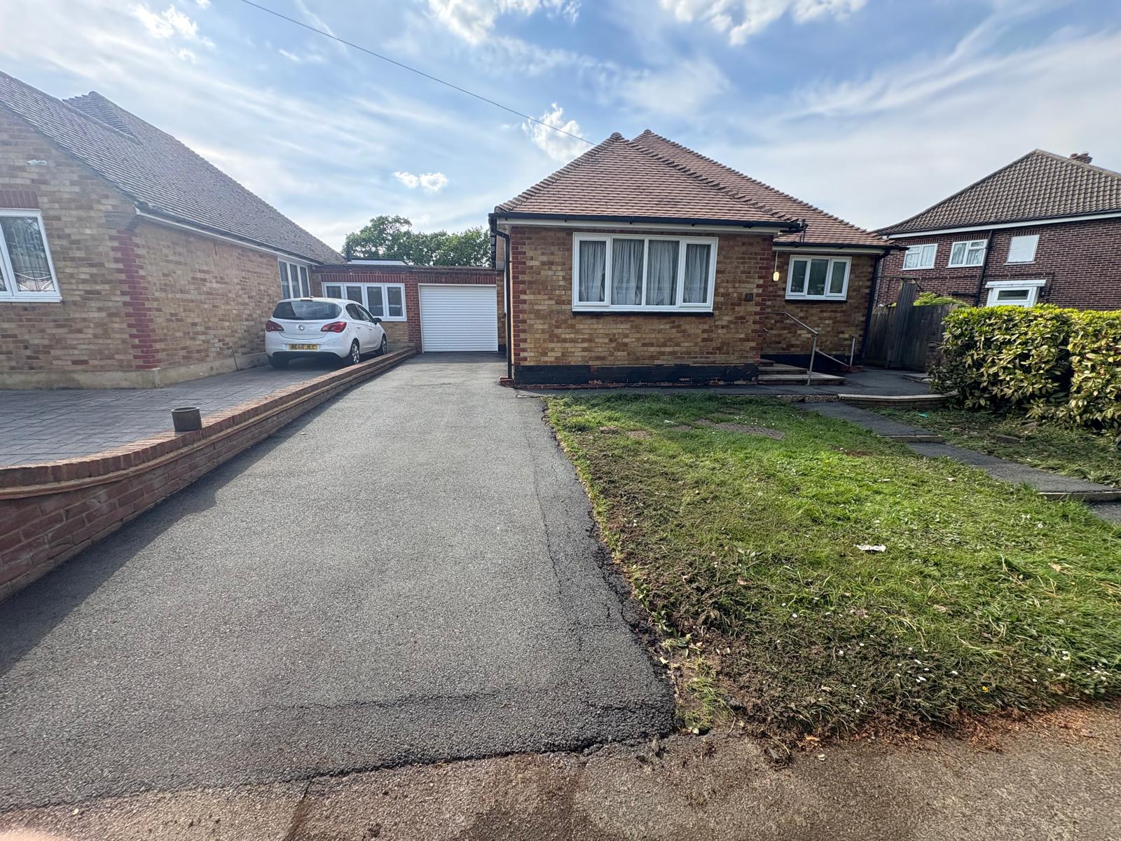 Pressure-washing work at a bungalow driveway